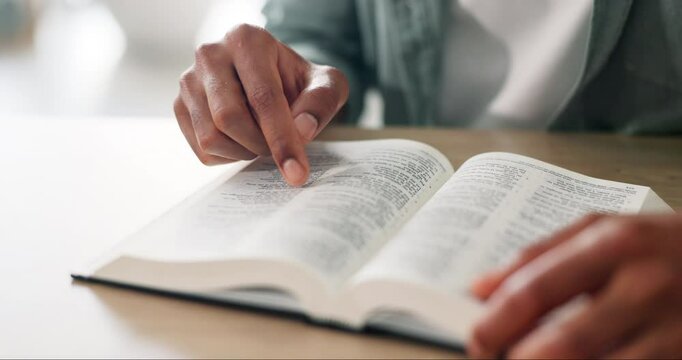 Worship, hands and man with bible in home for religion study, reading or spiritual journey. Hope, gratitude and male person with scripture for peace, faith or guidance prayer in living room at house.