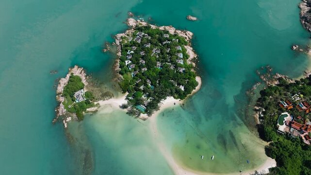 Island resort with lush green vegetation and turquoise water, featuring scenic rocky shores and beaches. Bo Put. Ko Samui, Thailand.