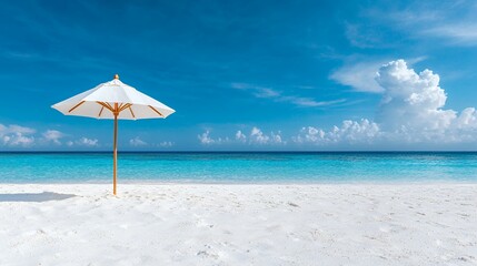 Beach Parasol on White Sand with Turquoise Water and Blue Sky Clouds