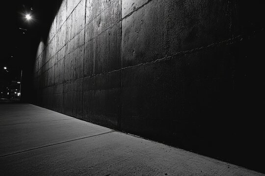 Fototapeta Monochromatic Street Corner A Study in Urban Light and Shadow Composition