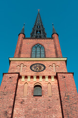 Low angle close up shot of Riddarholmen Church tower, Stockholm, Sweden