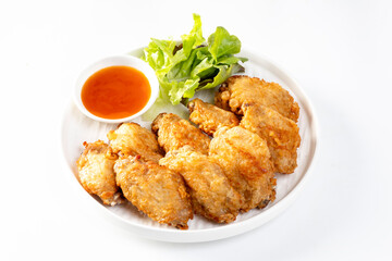 Crispy fried chicken wings on white background
