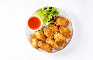 Crispy fried chicken wings on white background