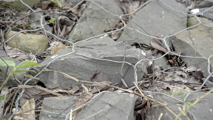 stones tied with wire for support to prevent landslides, river barriers made of stones wrapped in wire