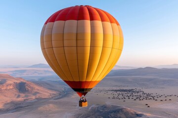 Obraz premium Hot air balloon ride over the desert landscape aerial view adventure experience sunrise atmosphere