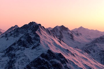Majestic snowy peaks with pastel sky illuminated by golden light at dawn