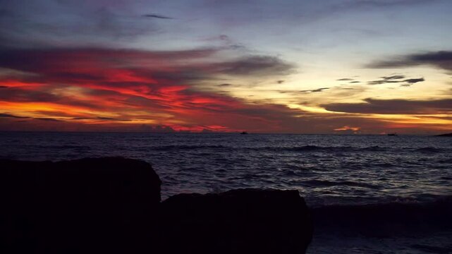 A beautiful colorful sunset on a beach in Kozhikode Kerala India with res sky