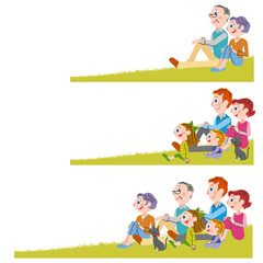 緑の芝生に座って遠くを見つめる家族