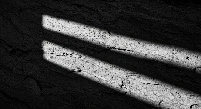 Dramatic Parallel Light Streaks on Cracked Dark Grey Textured Surface
