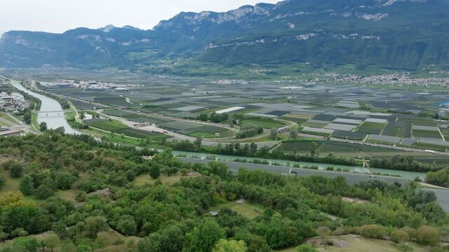 Aerial footage flying over an agricultural valley in northern Italy.