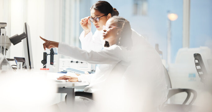 Collaboration, lab and scientists with computer, women and helping for medical research for healthcare. Pointing, manager and intern with info for assignment, teamwork and conversation for science