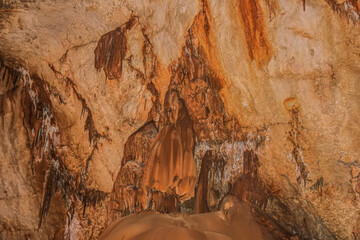 Abstract drawing of an underground cave with stalactites and stalagmites. Limestone karst formation. Travel and vacation concept. Digital painting. Abstract naturalism, relief pattern.