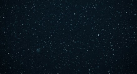 Fototapeta premium Abstract falling snowflakes on dark background for winter and holiday themes