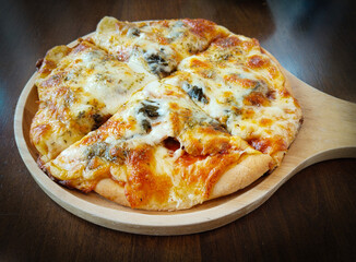 Thai Style Braised Pork with Cowa Leaves Pizza on Wooden Board and Background