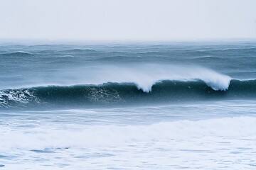 An expansive ocean vista under heavy rain, raindrops creating patterns on the waves, lending an air of beauty amid nature's dynamic forces.