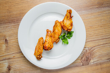 Juicy chicken wings are perfectly cooked and seasoned, presenting an appetizing dish ready to enjoy