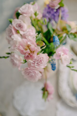 Delicate spring bouquet in a home interior in pink shades