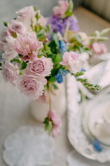 Delicate spring bouquet in a home interior in pink shades