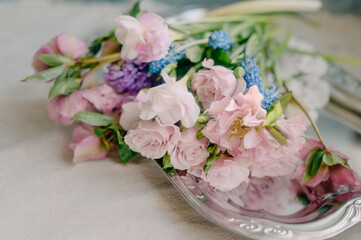Delicate spring bouquet in a home interior in pink shades