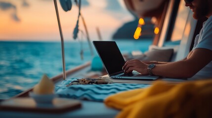 A man is sitting on a boat and typing on a laptop. The scene is set on a beautiful, calm ocean at sunset. The man is focused on his work, possibly writing or browsing the internet