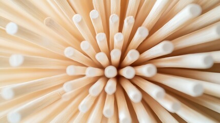 Close-up view of many wooden chopsticks, radiating outward