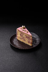 A piece of pink layered cake with strawberry flavor