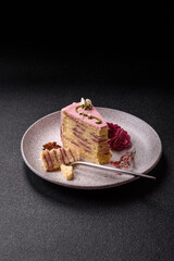 A piece of pink layered cake with strawberry flavor