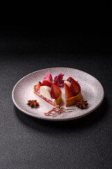 Round sweet tart with strawberry pieces and cream