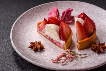 Round sweet tart with strawberry pieces and cream