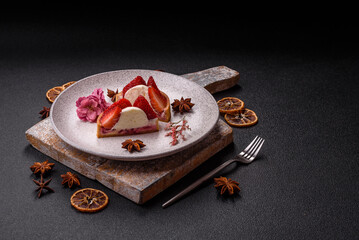 Round sweet tart with strawberry pieces and cream