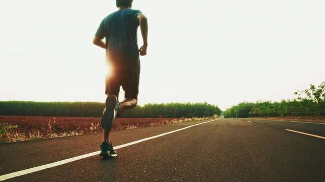 runners is running on the road at outdoors.healthy lifestyle and sport concepts.Sprinting Endurance Workout Training.running for Striding Towards the Future.The Determined Runner.