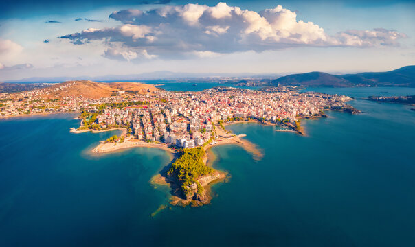 Breathtaking summer view from flying drone of Chalcis town. Amazing morning seascape of Aegean sea, North Euboean Gulf. Fantastic outdoor scene of Euboea island, Greece. Traveling concept background.