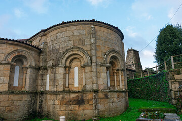 Exterior of the ancient Monastery of Camanzo with three semicircular apses in Spain