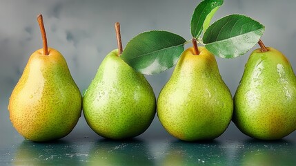 Four green pears with a leaf on top. The pears are arranged in a row and are all the same size