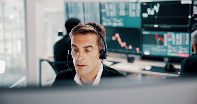 Business, headset and man in office, computer and call center for investment advice. Person, employee and consultant in workplace, headphones or help desk with stock market, trading expert or talking