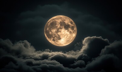 Full moon behind dark clouds at night