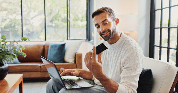 Home, man and smile with laptop for credit card, password or banking app for subscription. House, male person and happiness with tech for debit details, online shopping or payment for website on sofa
