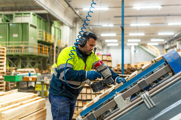 Man worker arranging pallets in a recycling plant factory