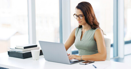 Office, businesswoman and typing with laptop for research, news story and smile for publication. Career, female person and journalist with digital for blog website, information and online for article