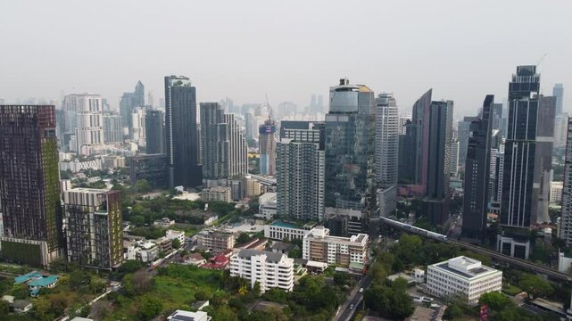 rise crane drone aerial to right sweep of bangkok thonglor