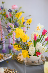 spring flower arrangement of tulips, earcice, geocinths