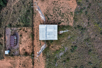 aerial view of array of towers mast antennas  station in the African bush