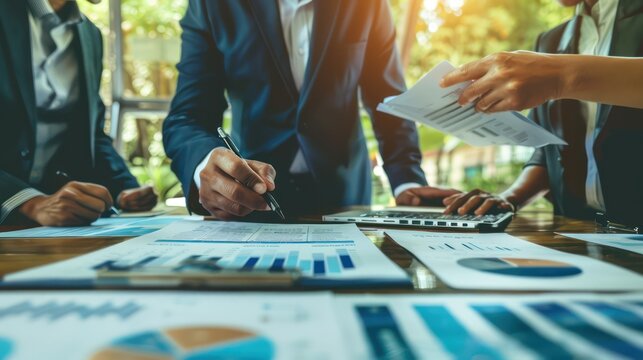 A businessman explaining the executive summary of a business plan to colleagues.