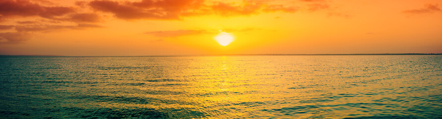 Sunset over the sea. Horizontal banner