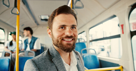 Business, smile and commute with man on bus for pride, journey and meeting schedule. Public transportation, happy and urban with person in tram vehicle for travel, professional and passenger