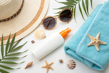 Sun protection products on white table, flat lay. Summer vacation concept