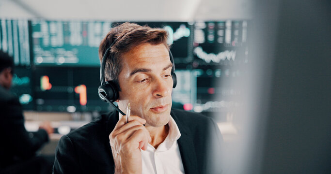 Broker, man and talking with headset by computer for investment advice, market insight and trading FAQ. Call center, portfolio management and consulting client with stock trends review and assistance