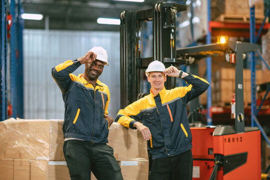 Happy male worker in warehouse cargo employee engineer team black and white industry working people