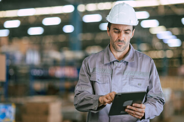 Warehouse worker, Engineer manager looking at tablet screen serious hard working, professional look