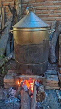 "rice cooker" a traditional tool for cooking rice over a fire